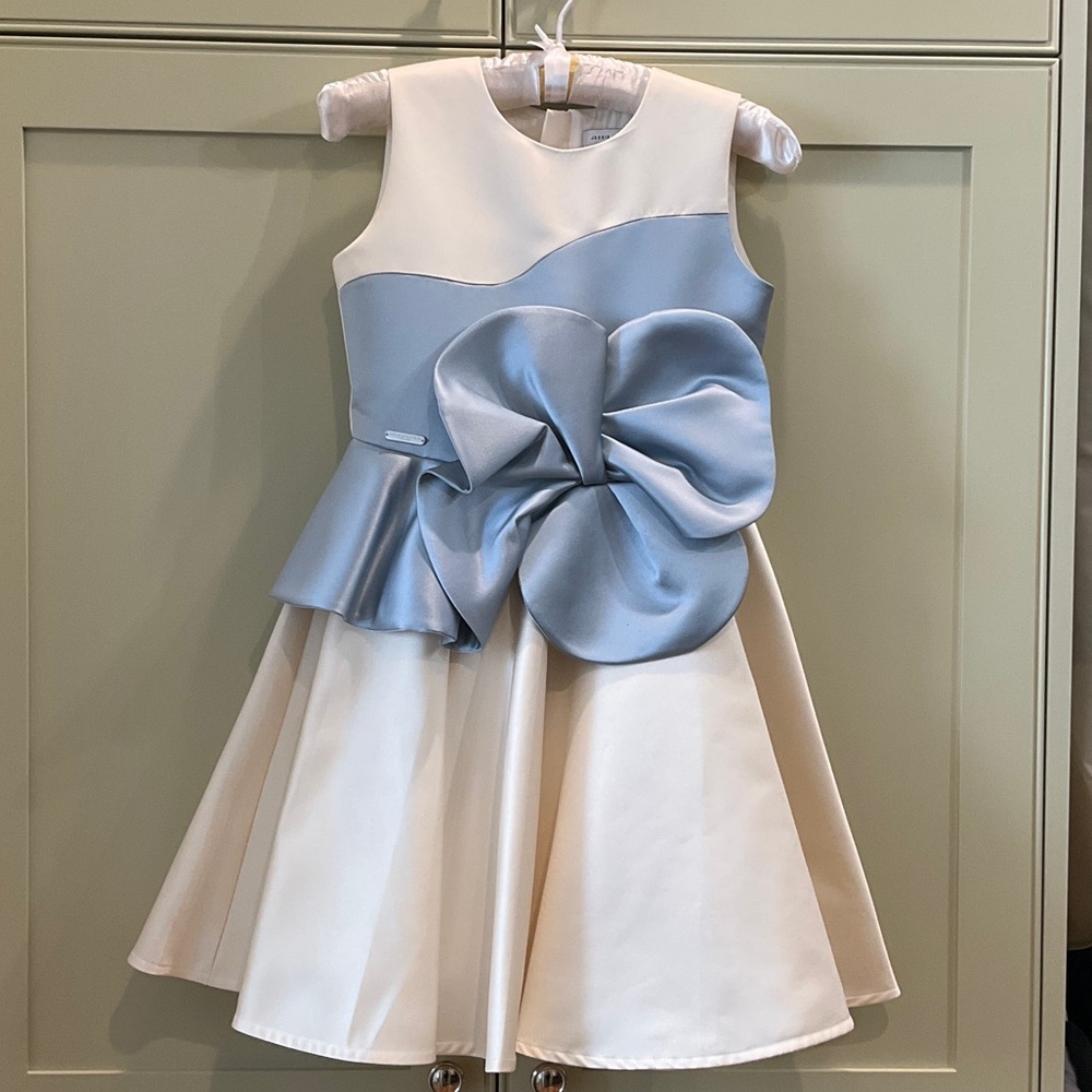 Jessie and James London ivory satin dress with silver blue bow detail